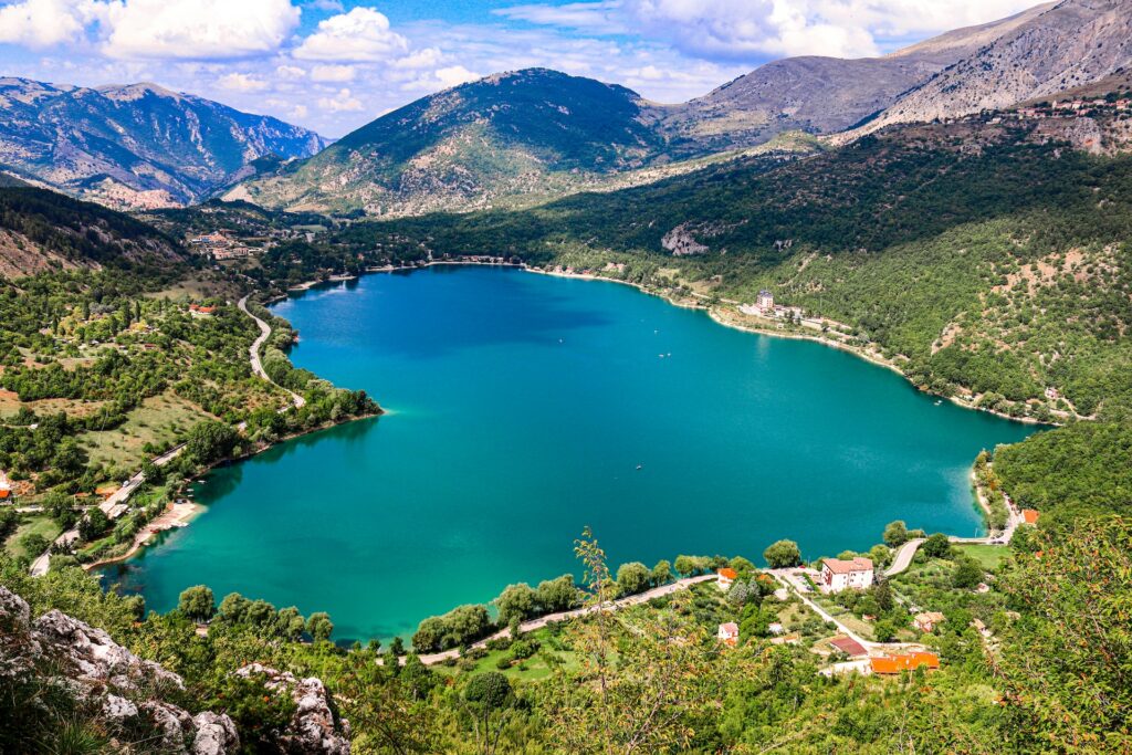 Heart shaped lake with mountains in the background