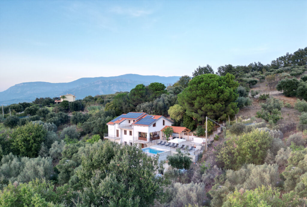 Large house with outside pool set within countryside