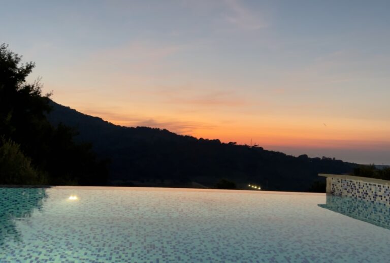 infinity pool at sunset