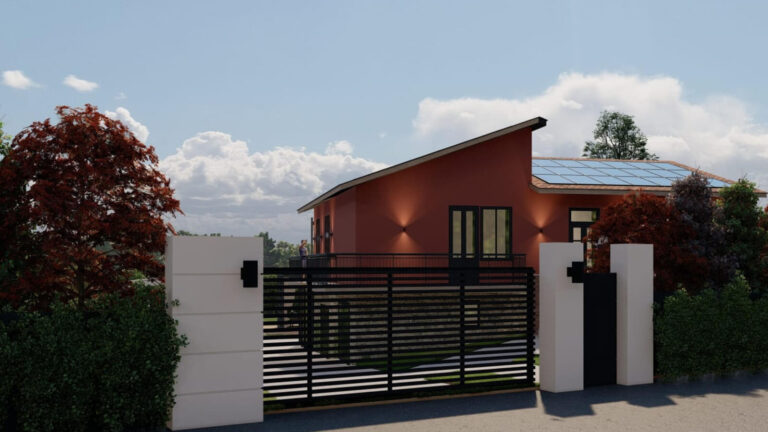 Gated driveway with house with terracotta exterior behind