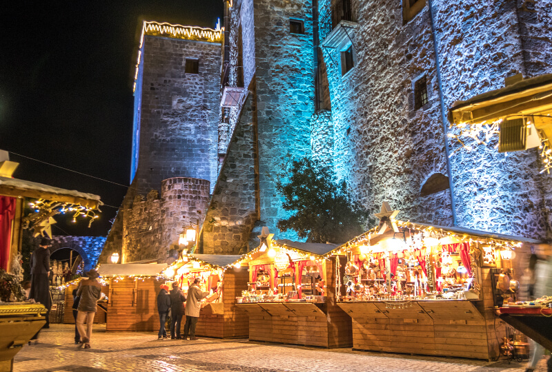 Traditional Christmas market in the historic Castle of Limatola. Shopping, winter holidays and people concept