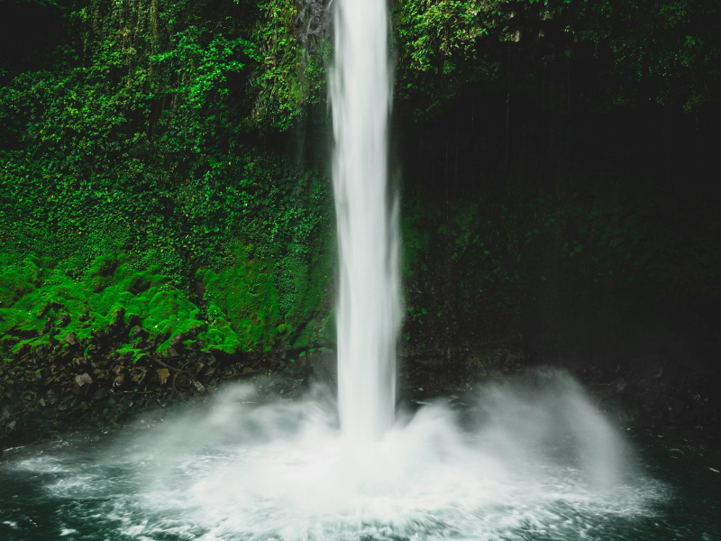 Powerful waterfall into pool