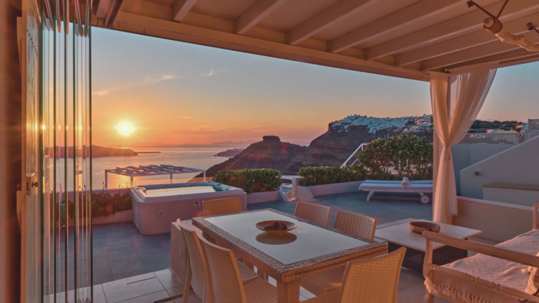 Firostefani Santorini Caldera Villa View outside dining table and sunset sea view