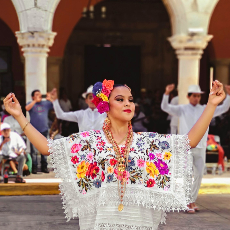 Mexican girl dancing in Merida City, with colorful clothing