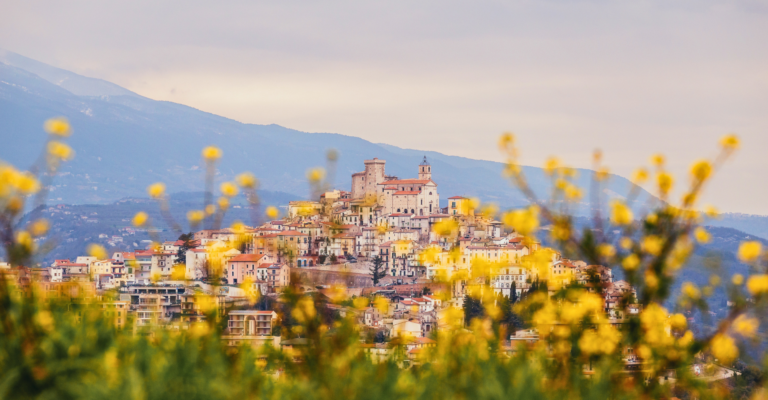 hiltop village of Casoli with yellow flowers in the foreground